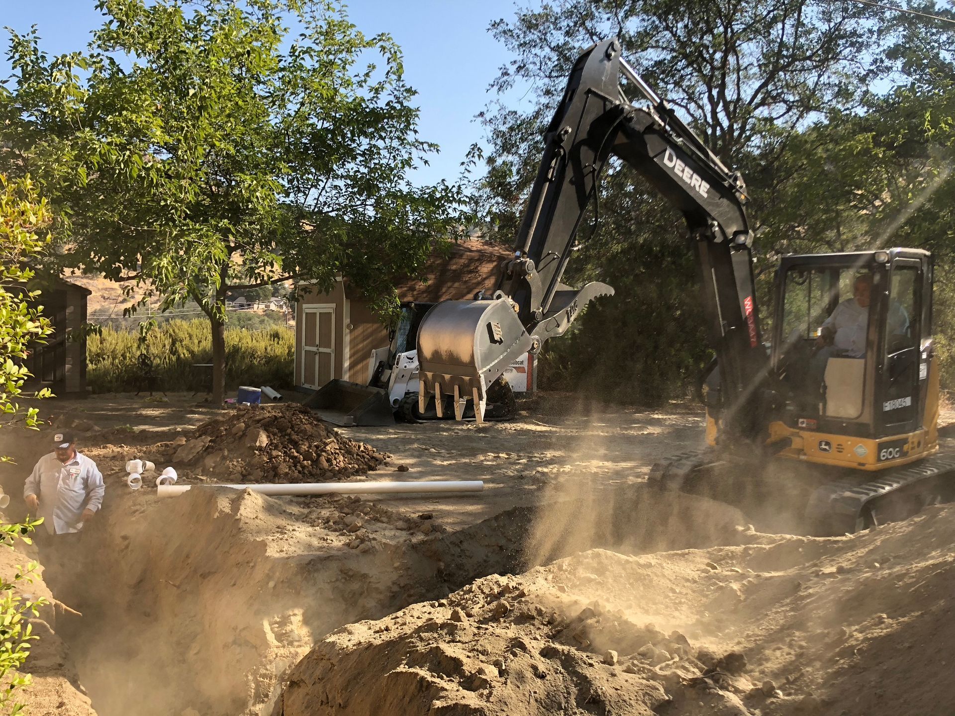 Phase 1: Precision site preparation for a new septic system — Big Bore Drilling Inc. (Class A & C42 Licensed) Big Bore Drilling Inc. crew preparing the site for a residential septic system construction project in Sanger, CA.