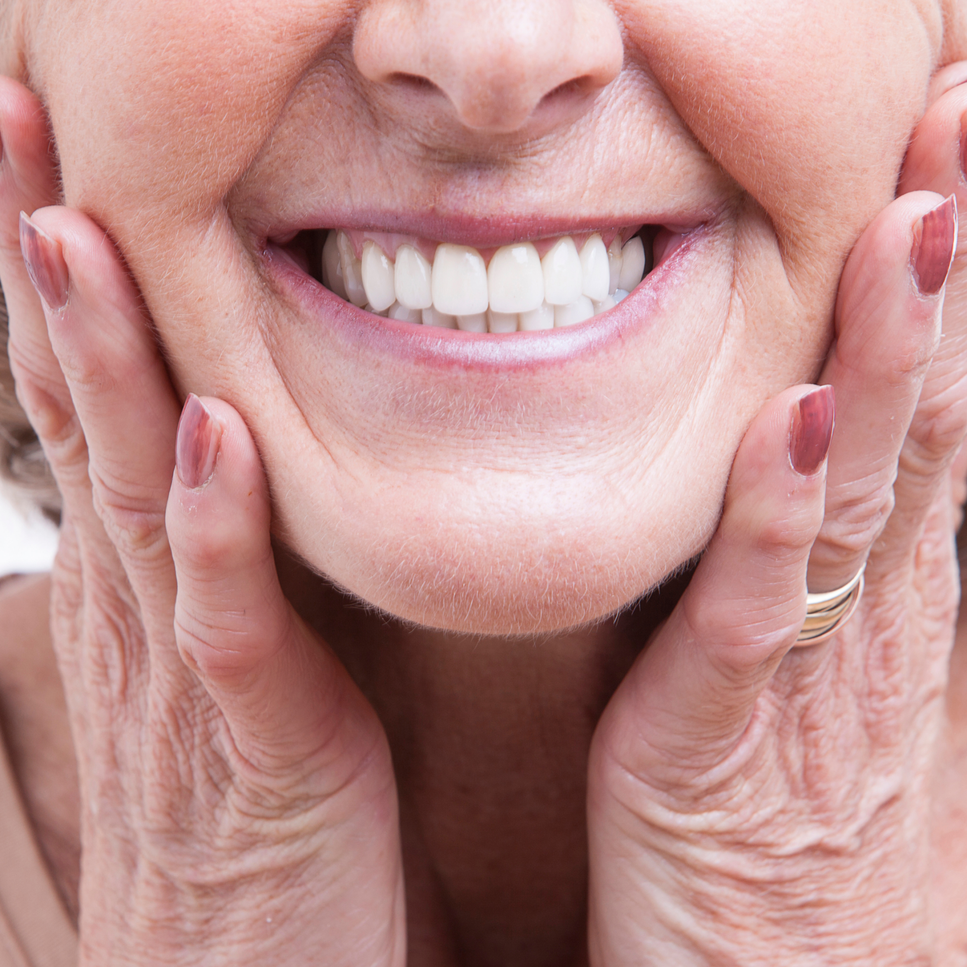 Get full and partial dentures in Mt. Pleasant SC Woman holding mouth | Dentures in Mt. Pleasant SC