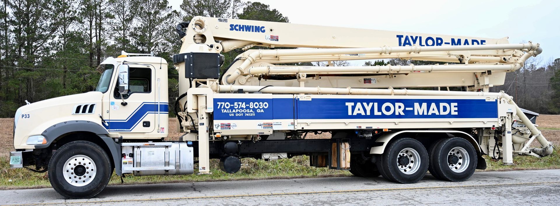 A taylor made truck is parked on the side of the road