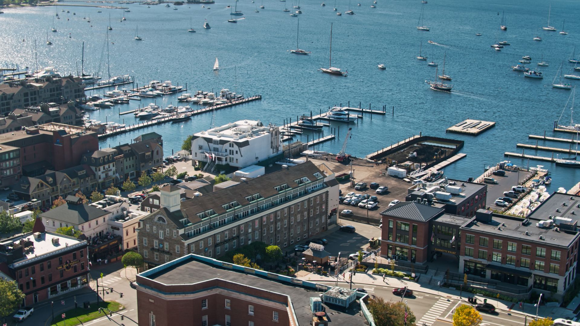 An aerial view of a city with boats in the water