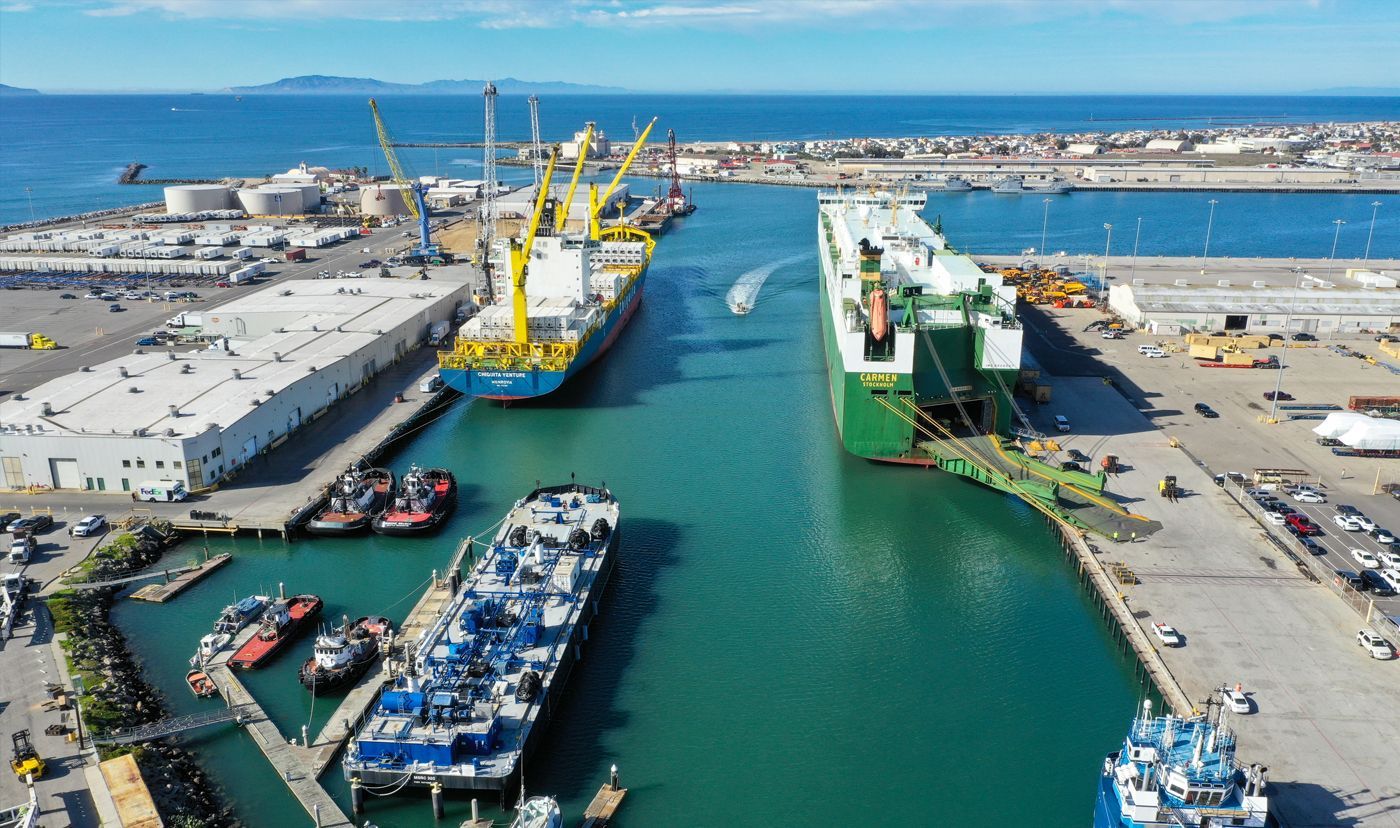An aerial view of a harbor with boats docked in the water.