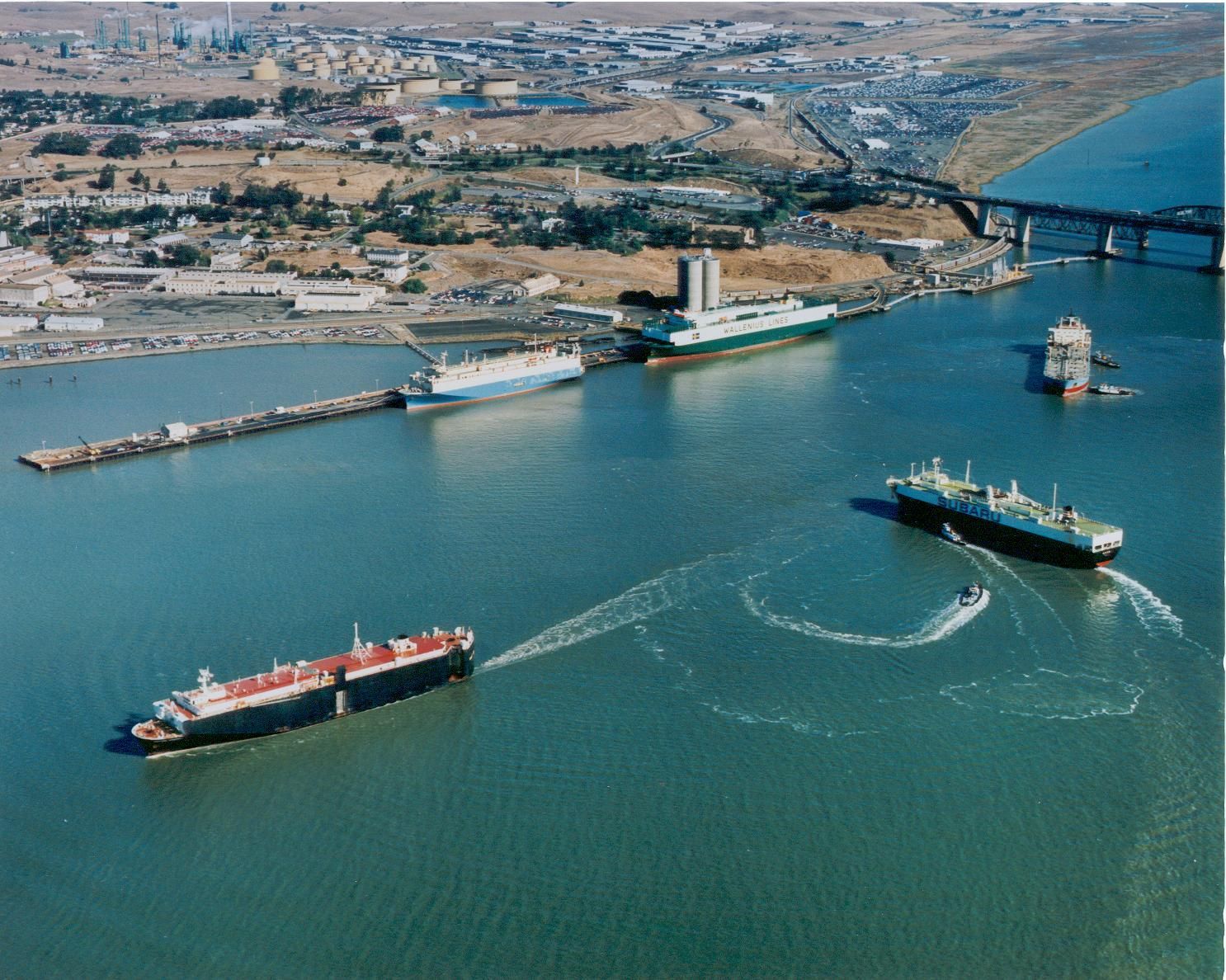 An aerial view of three ships in a body of water