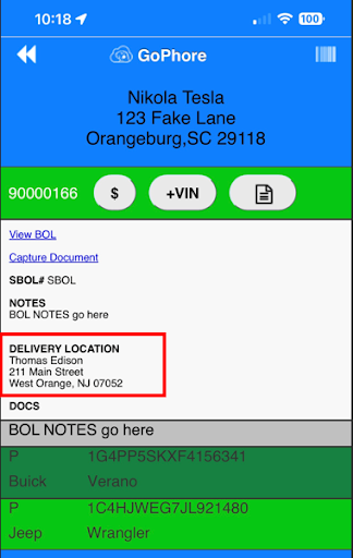 A phone screen shows a delivery location for nikola tesla