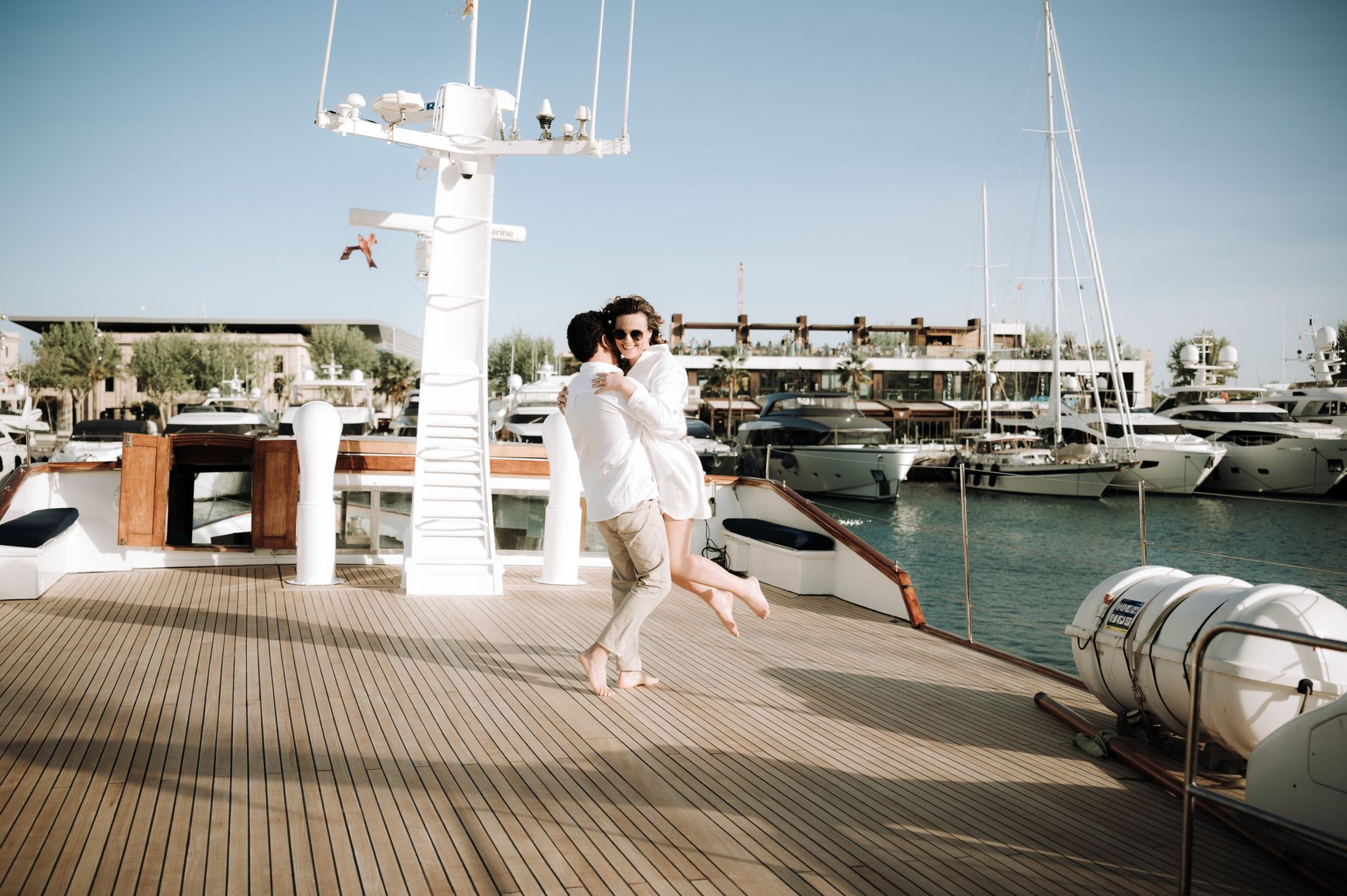 A couple during a marriage proposal in a boat in Mallorca