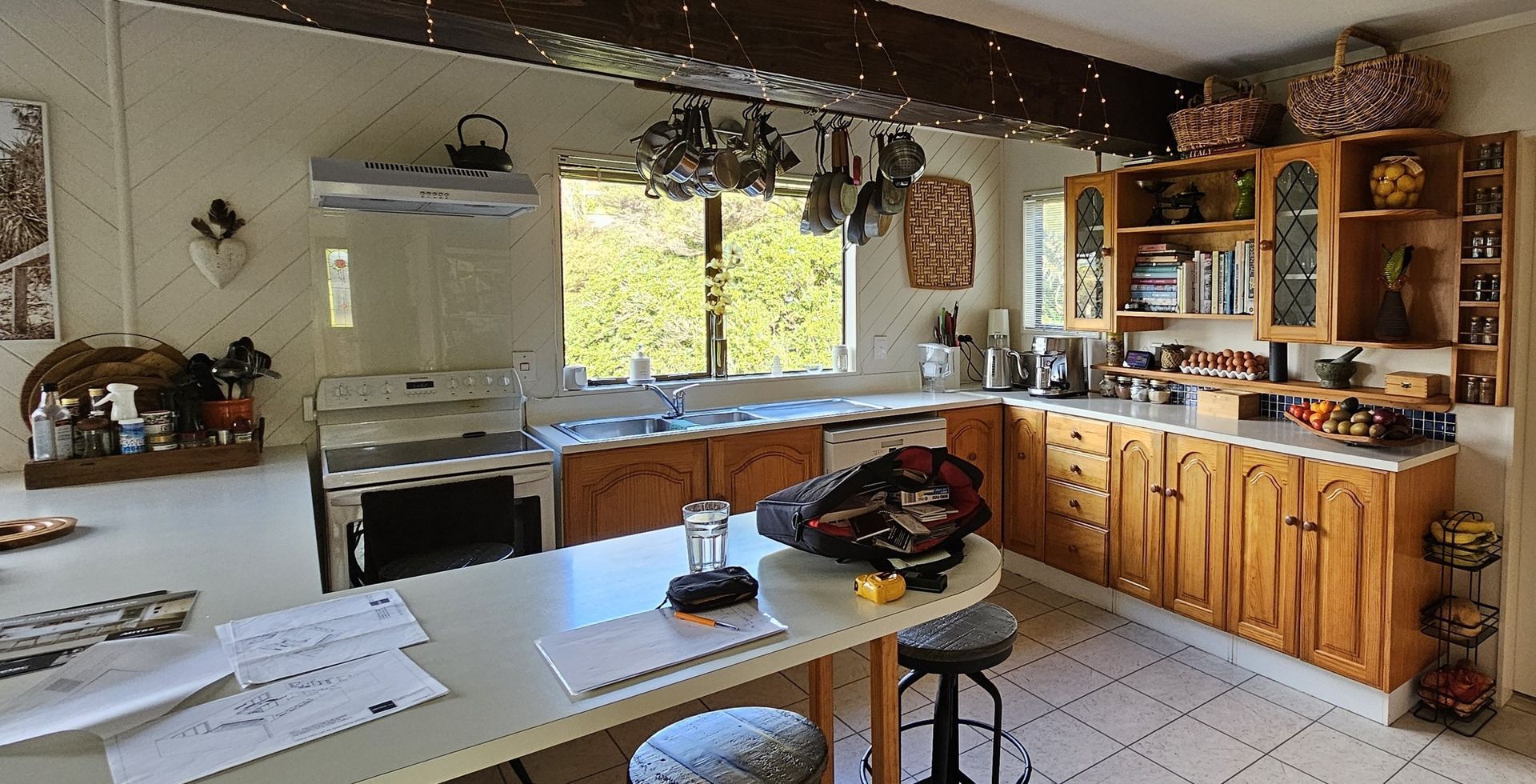 A kitchen with wooden cabinets and a white counter top