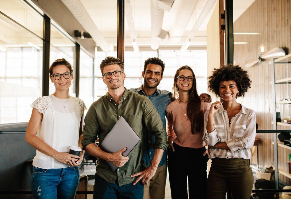 smiling employees in sandy springs office