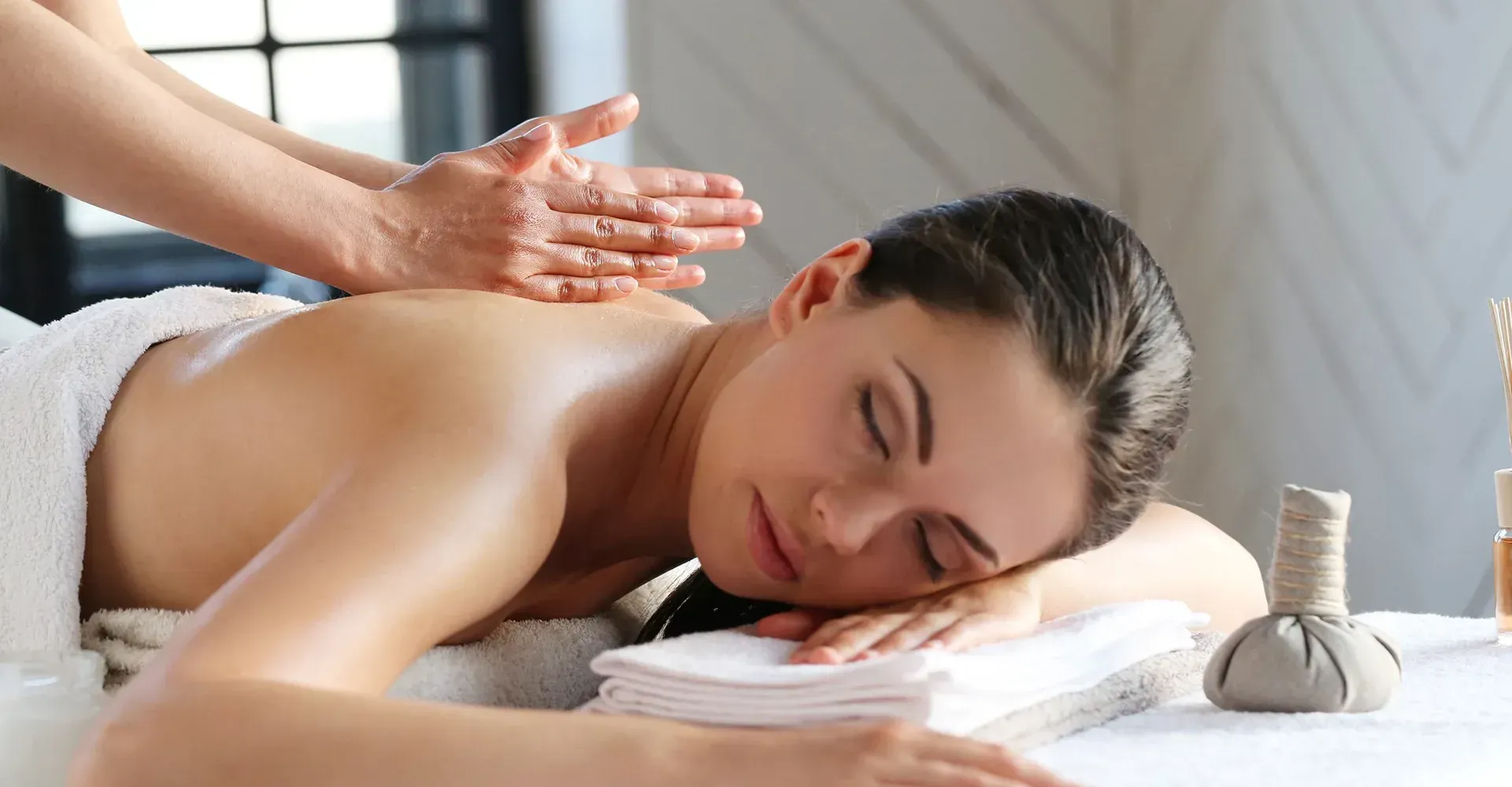 A woman is getting a massage at a spa.
