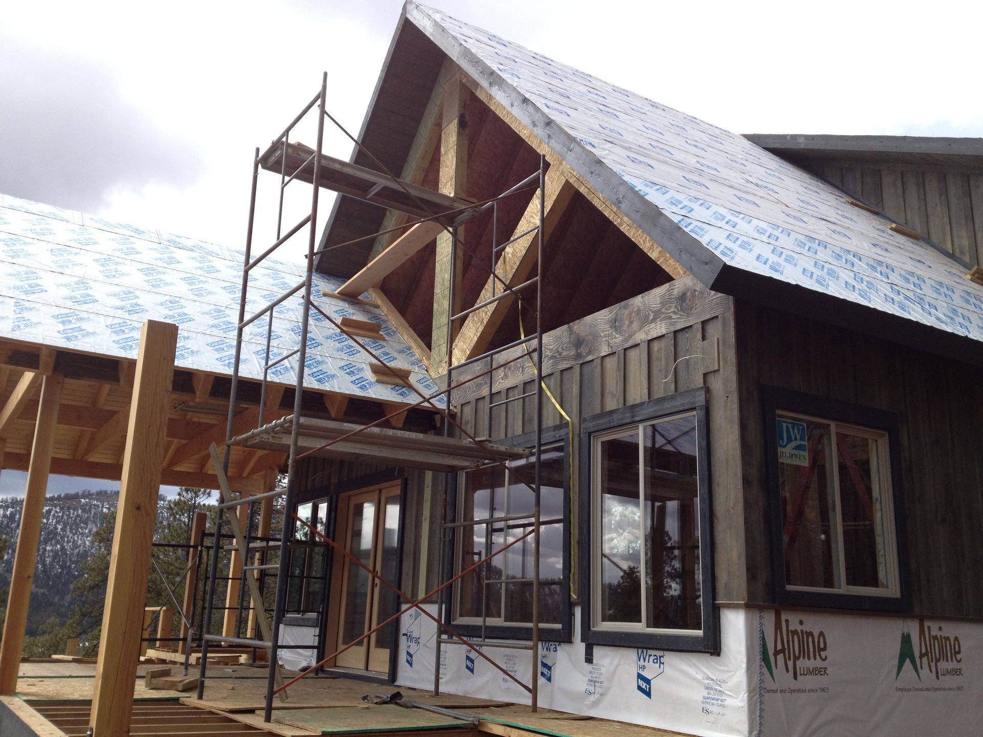 A house is being built with scaffolding on the side of it