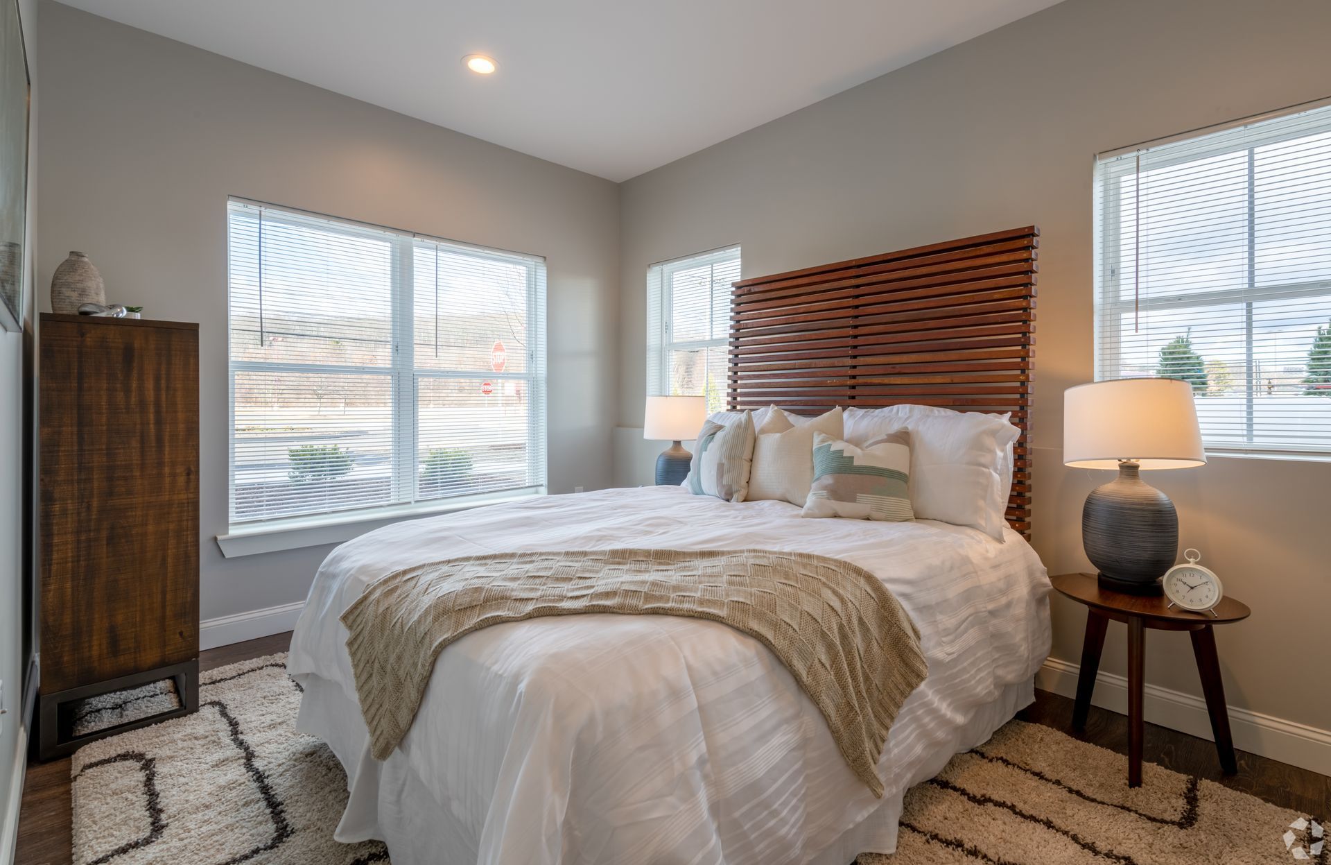 A bright, modern bedroom in a model apartment at The Kiln in Worcester
