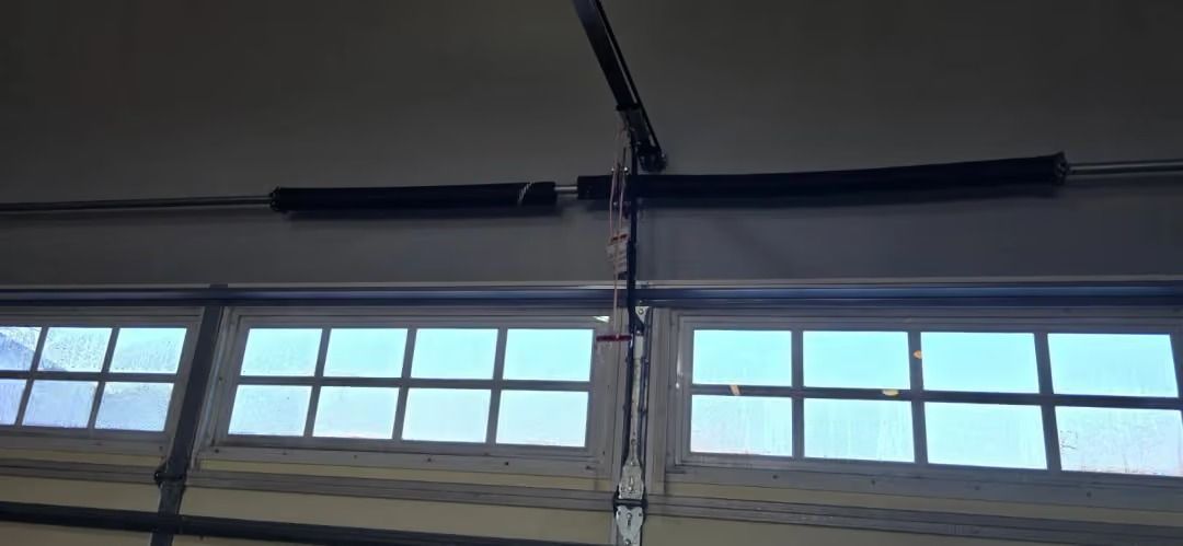 Garage door windows with blue sky visible through the panes