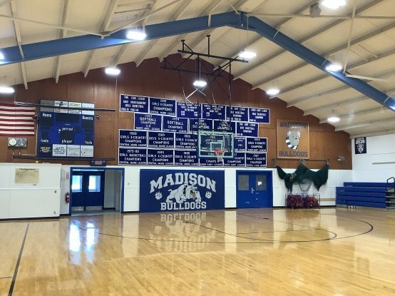 A gym with a sign that says madison bulldogs