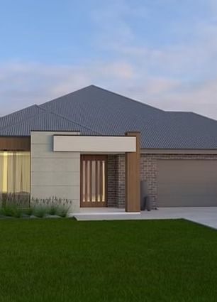 Modern single-story house exterior with grey roof, beige walls, and green lawn at dusk — Twomey Homes in Delacombe, VIC