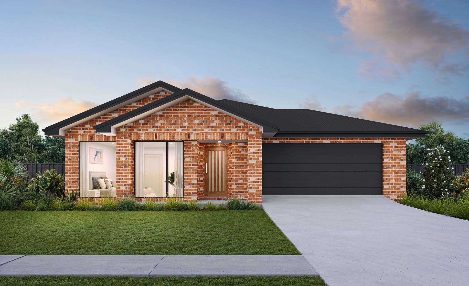 Brick single-story house with black roof, front porch, and two-car garage at dusk — Twomey Homes in Delacombe, VIC