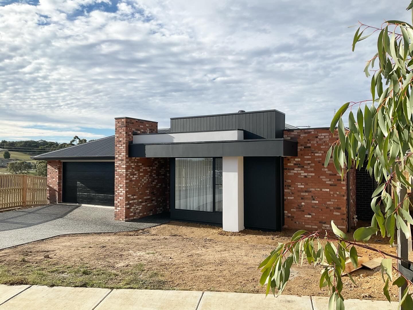 Modern Single-story House With Dark Brick, White Accents — Twomey Homes in Delacombe, VIC