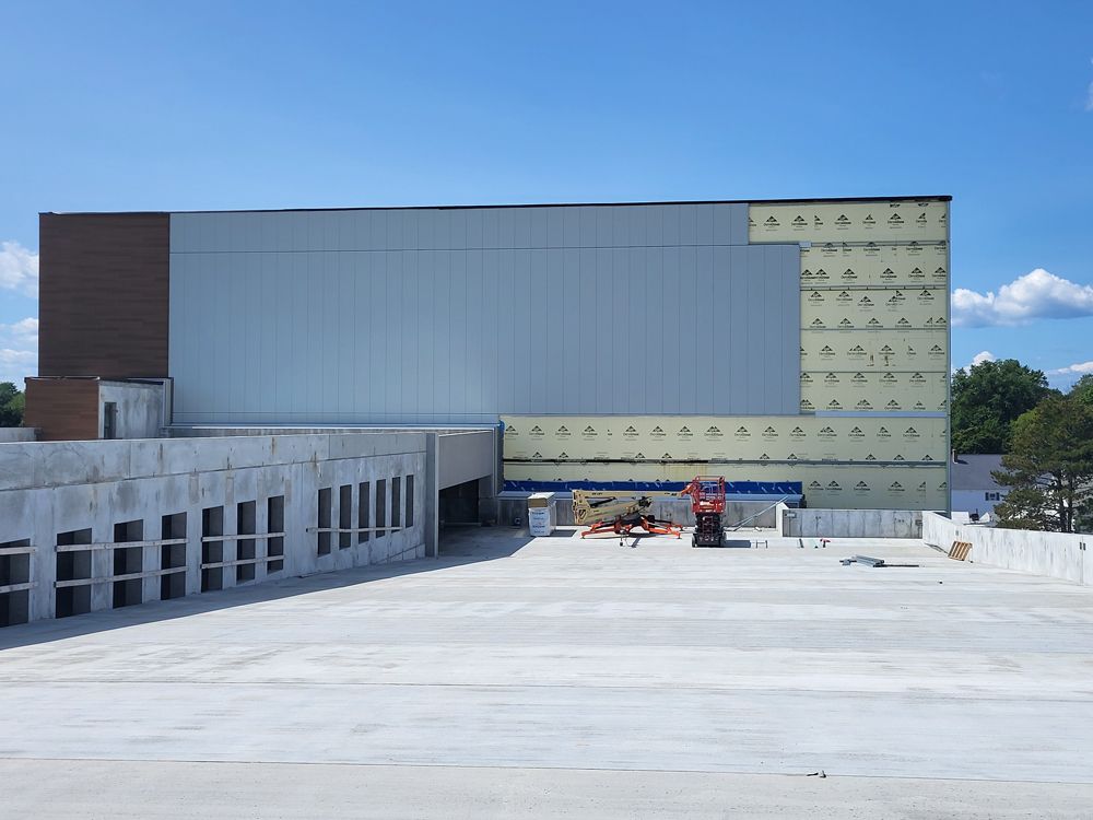 A large building with a lot of windows is being built
