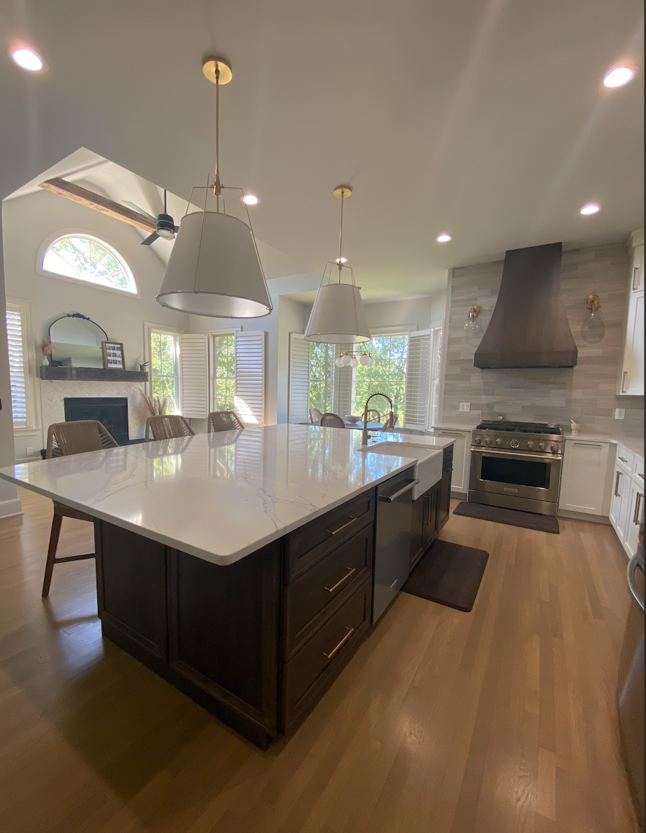 A kitchen with a large island in the middle of it.