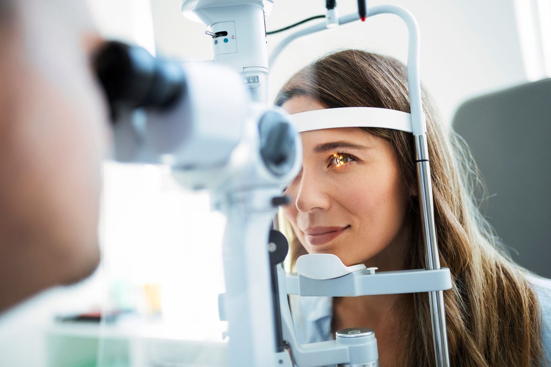 Optometrist in Colorado Springs, CO at Eagle Eyes Vision Center conducting a comprehensive eye exam 