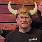 A man wearing a black shirt that says wicked fabrication