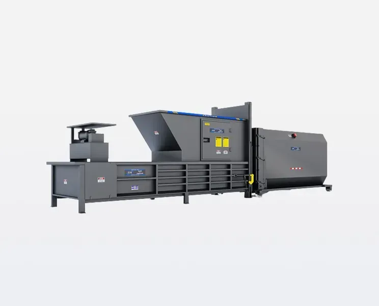 Gray industrial baler machine, used for compacting materials.
