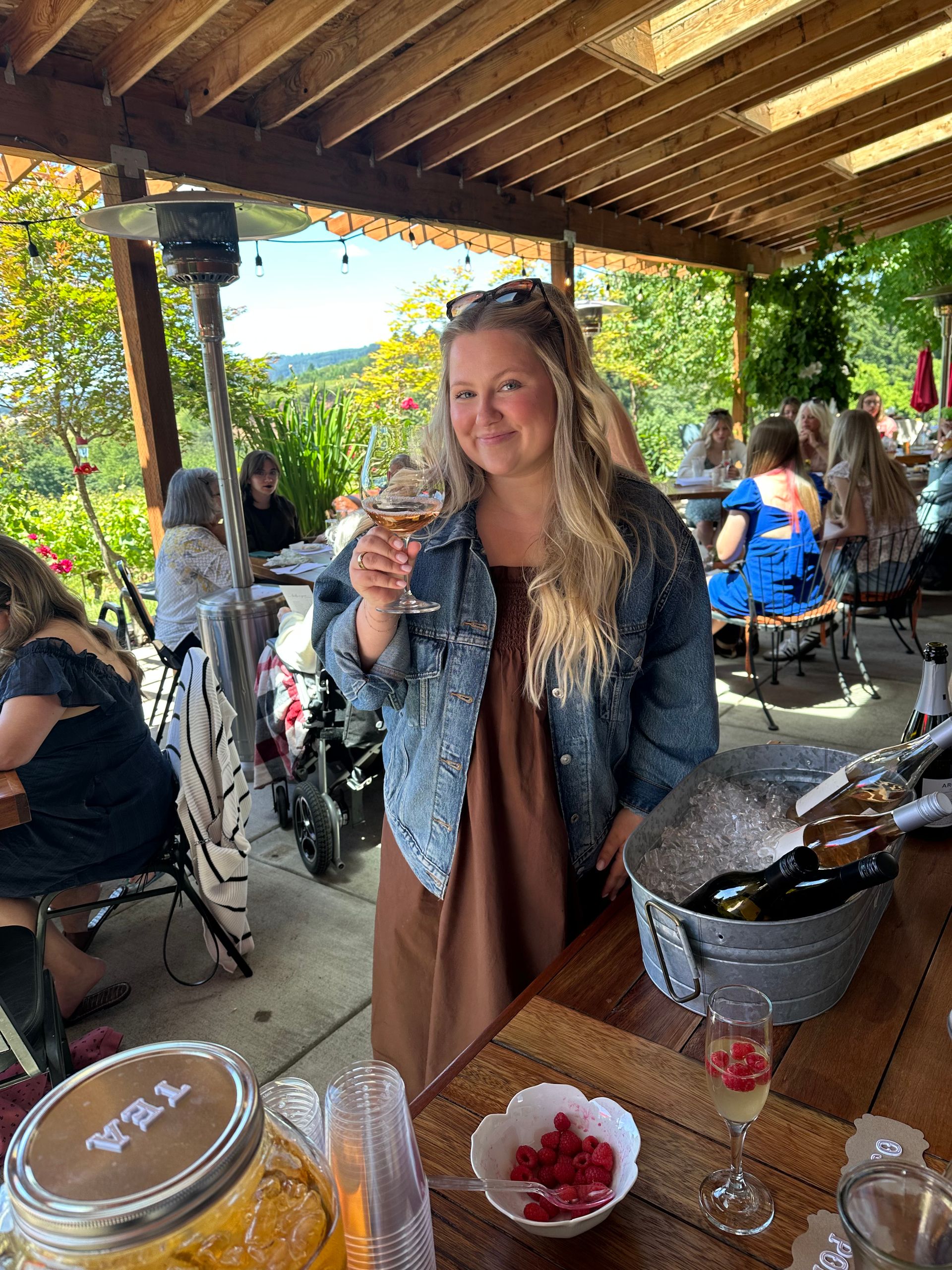 a woman on the back patio drinking wine
