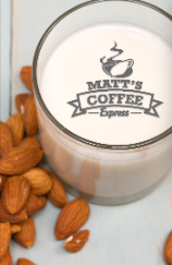 Matt’s Coffee Express candle with almonds on a light surface