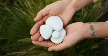 Solidified cremation remains stones displayed as lasting memorial keepsakes with natural texture and form