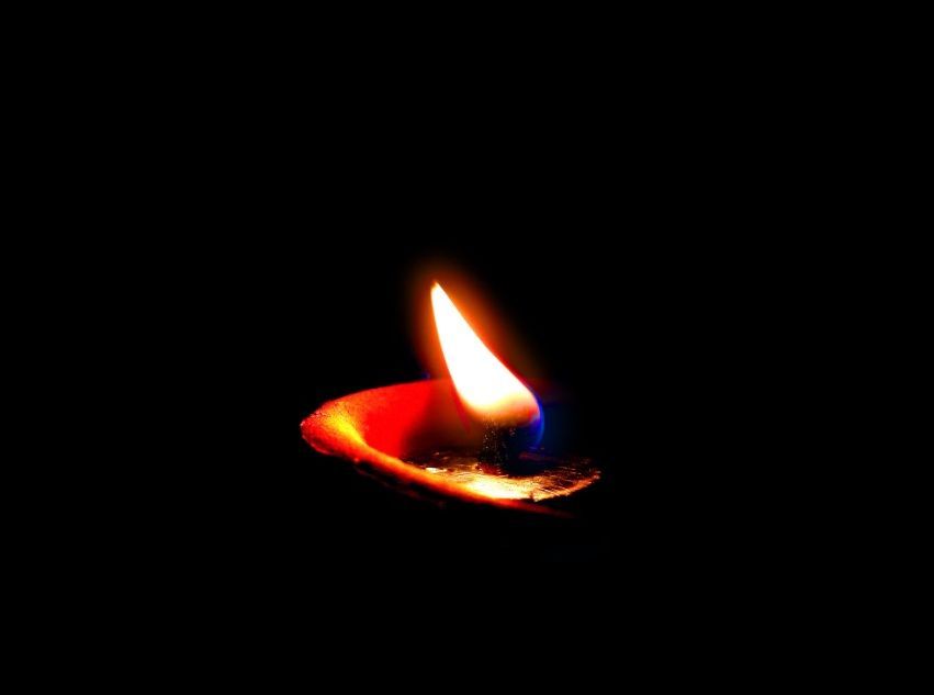 Memorial candle flame representing cremation services in Tulsa, OK.