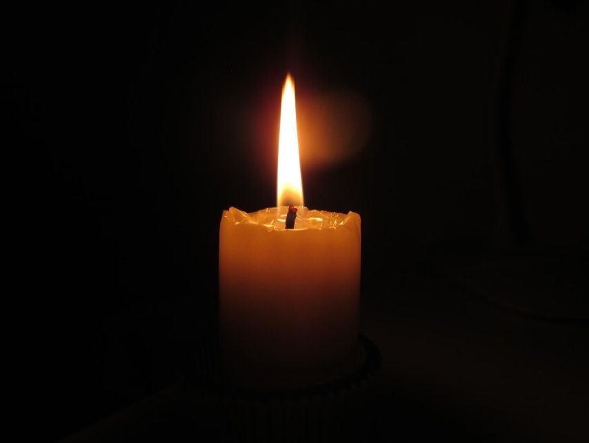 Memorial candle representing cremation services in Tulsa, OK planning.