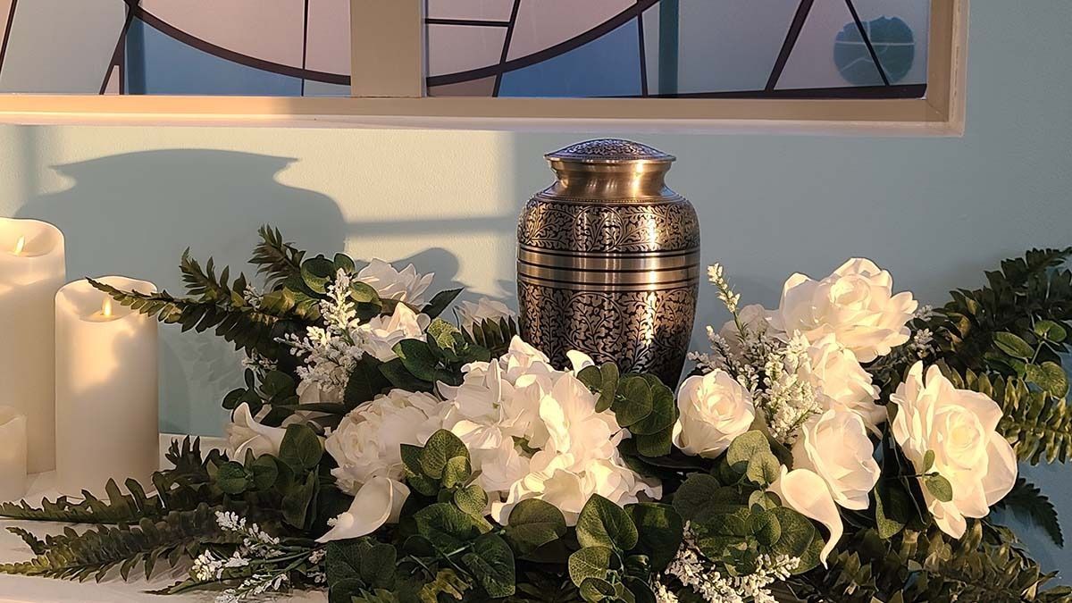 Display of cremation urns arranged for selection, featuring elegant designs for meaningful remembrance
