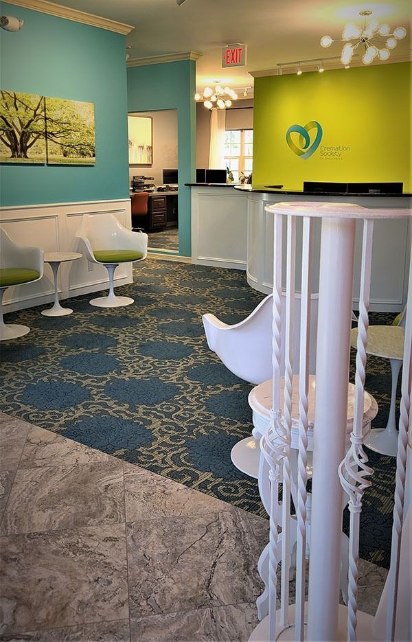Modern cremation service lobby with stylish seating and reception desk offering a warm welcome