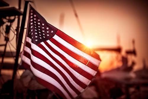 Flag retirement ceremony respectfully honoring worn American flags in a dignified and ceremonial setting