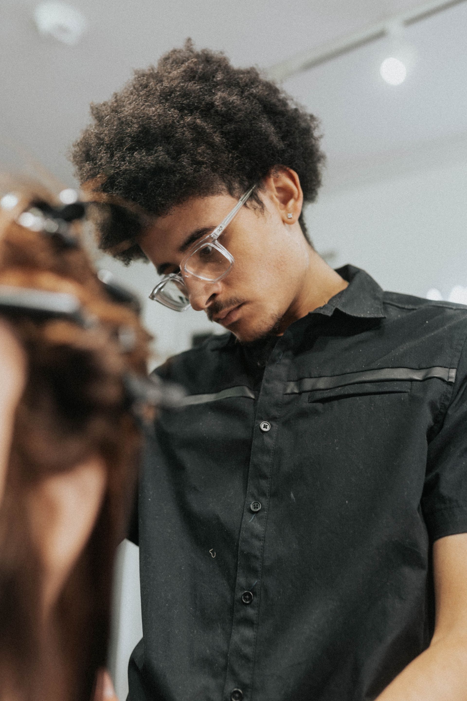 Client getting a precision haircut at Modern Man Barber Studio in Long Branch, NJ.