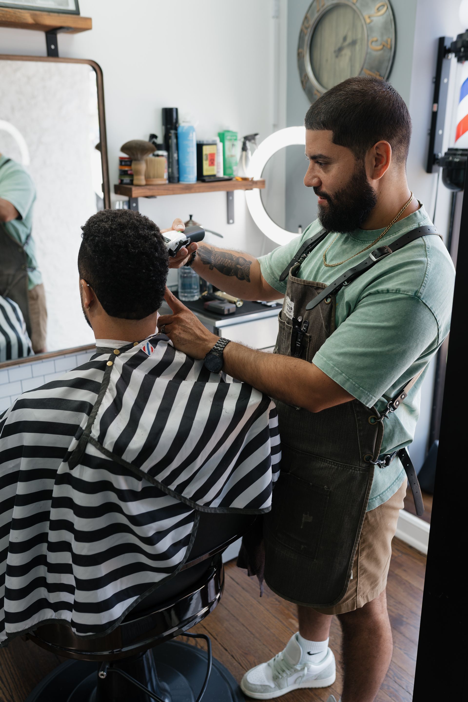Barber finishing a fade and beard line at Modern Man Barber Studio in Long Branch, NJ.
