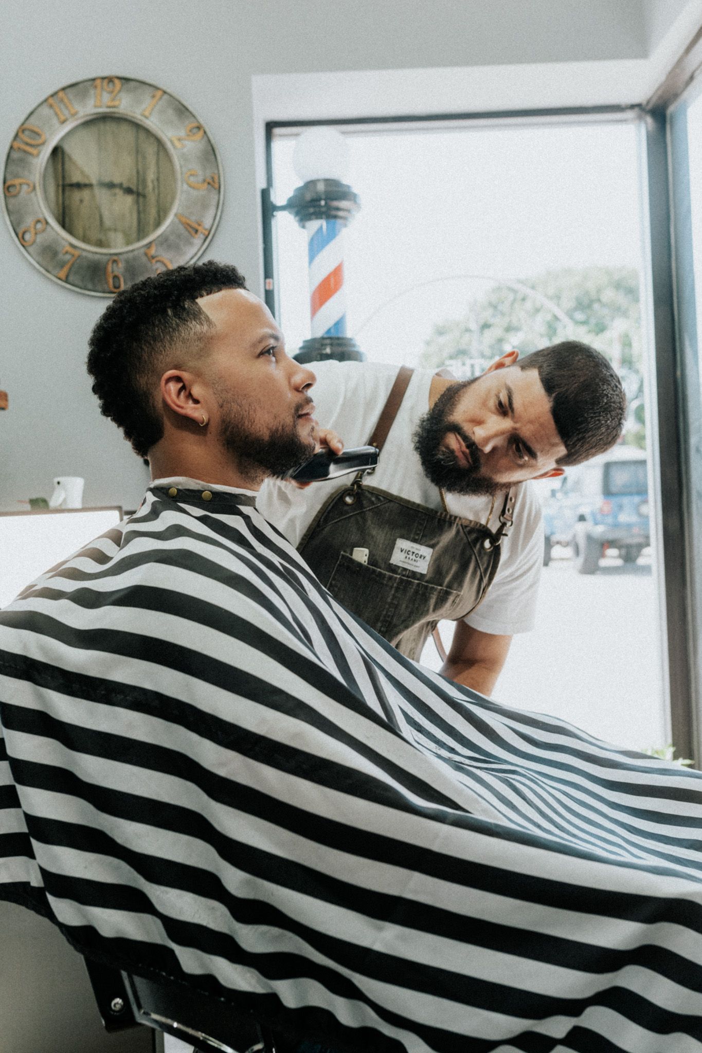 Barber finishing a tailored fade and beard line-up at Modern Man Barber Studio in Long Branch, NJ.