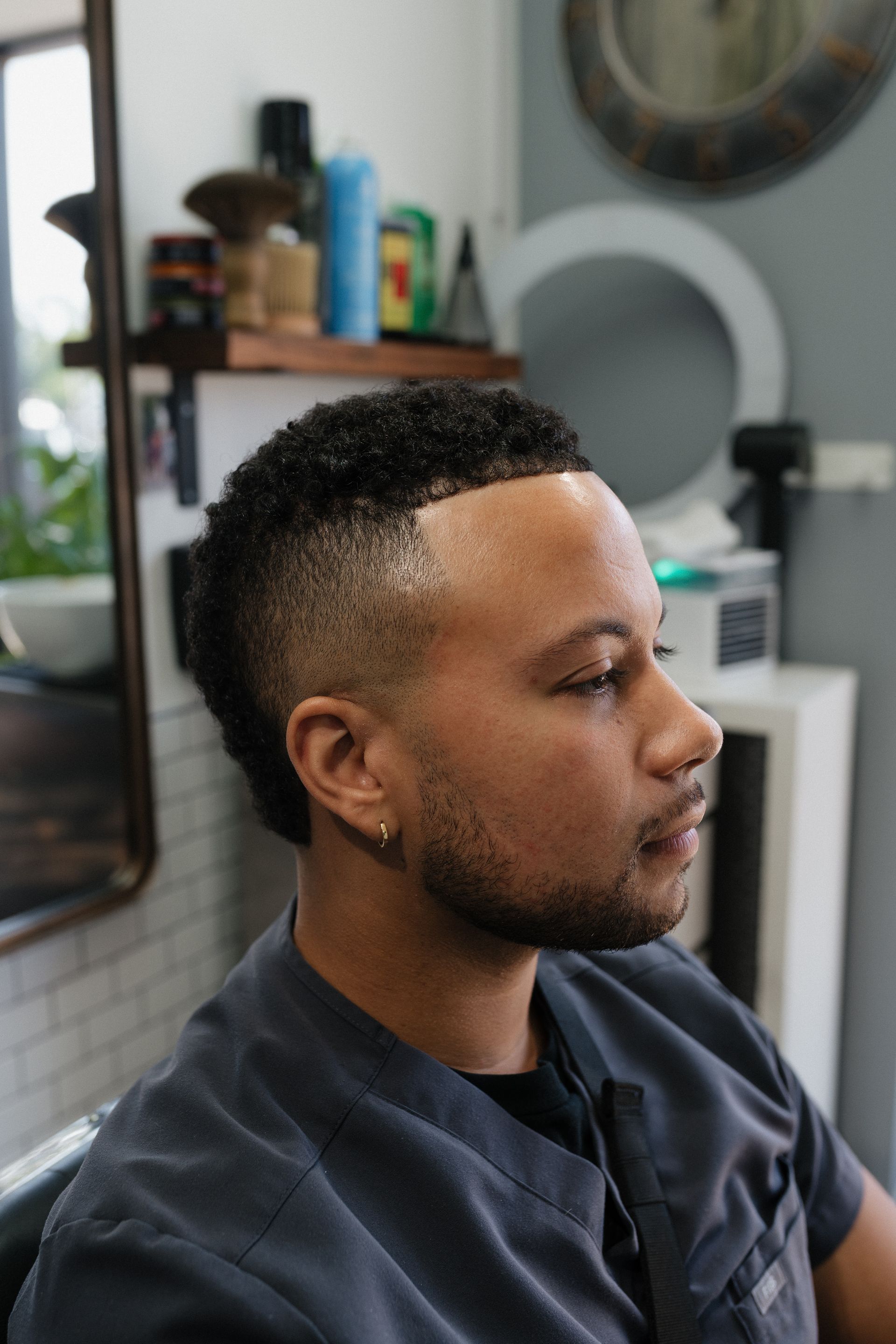Client getting a precision haircut at Modern Man Barber Studio in Long Branch, NJ for a clean, repeatable signature look.