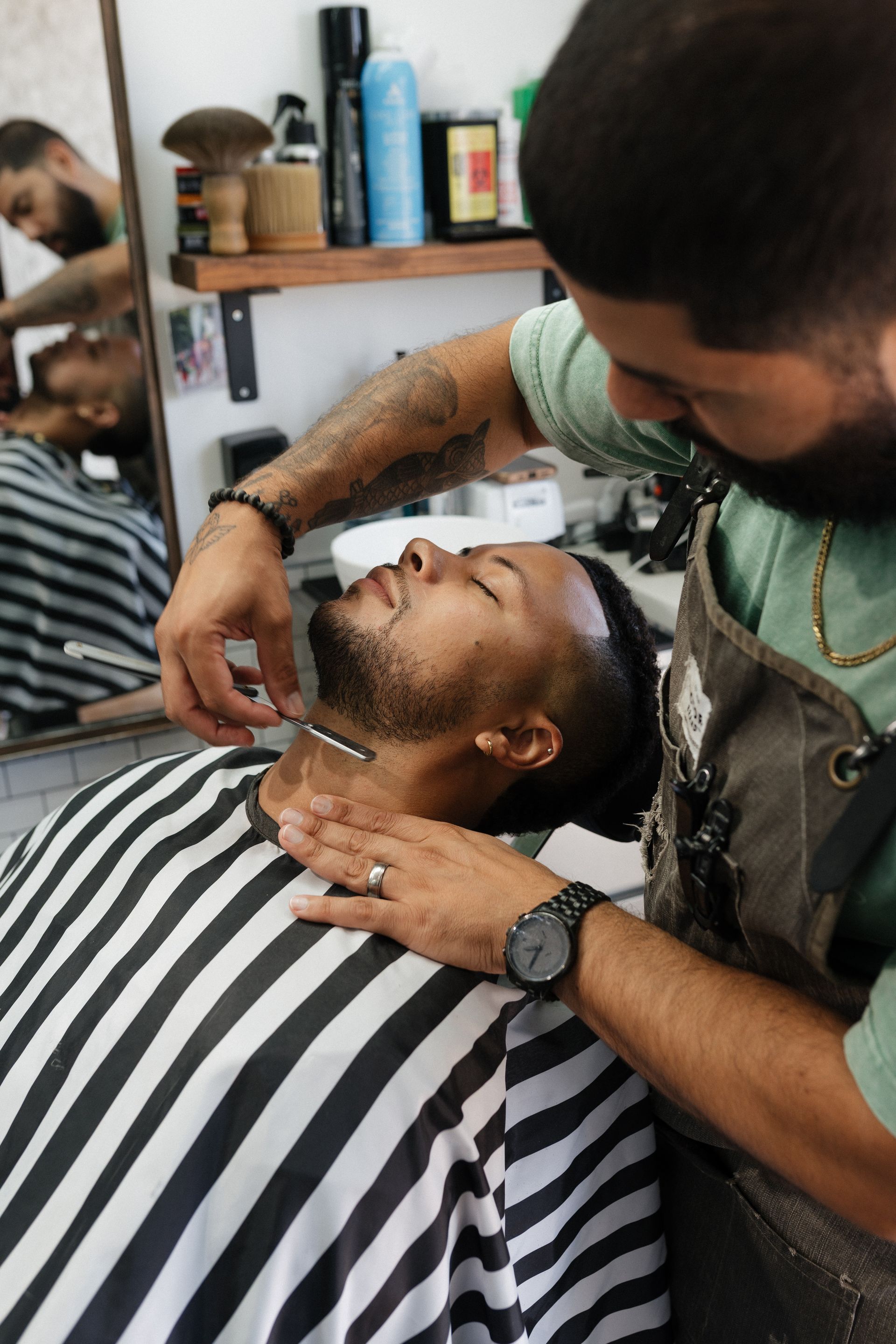 Barber finishing a clean fade and beard lineup at Modern Man Barber Studio in Long Branch, NJ.