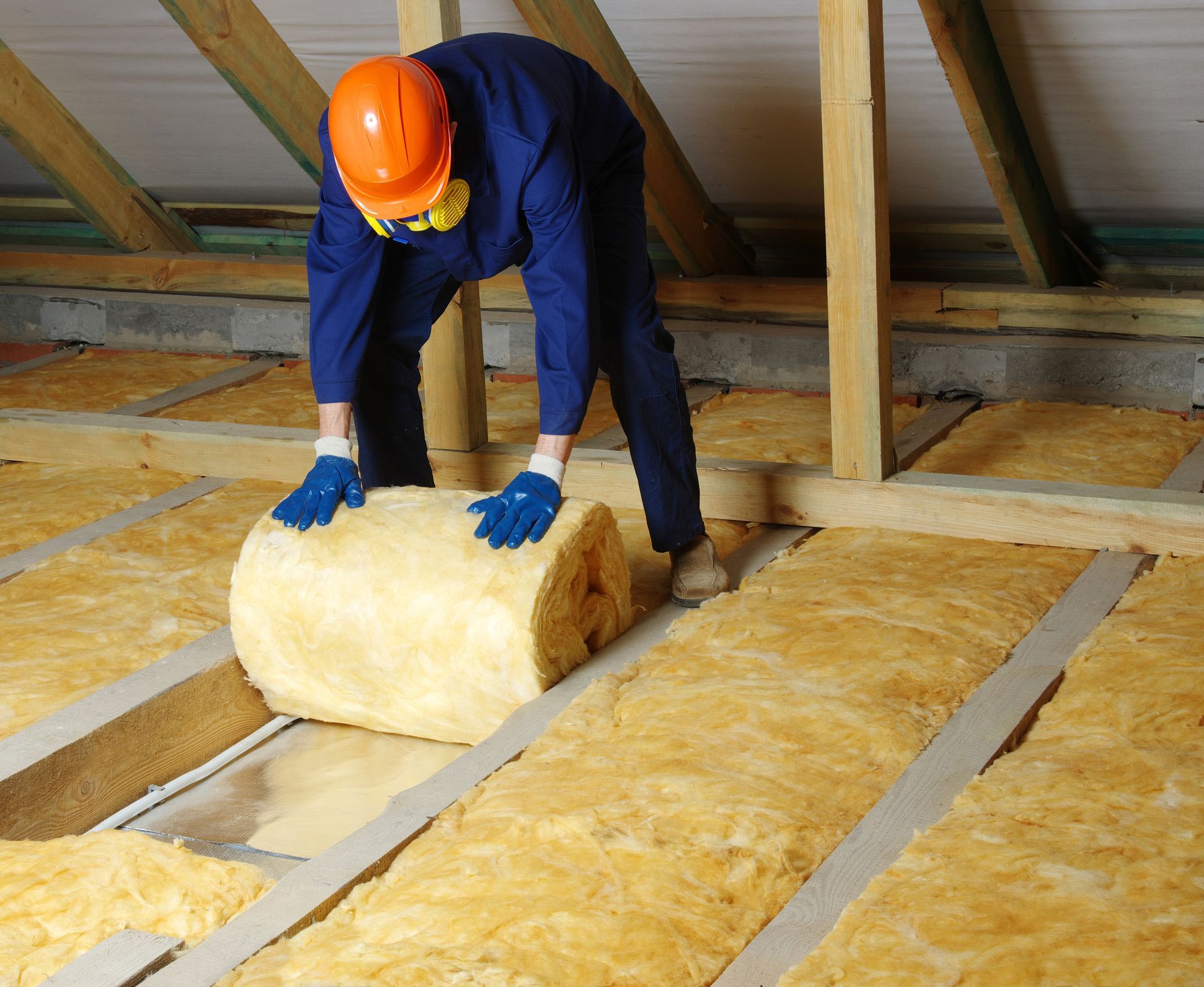attic insulation being installed