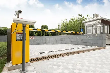 Yellow security gate with cameras, black and yellow striped arm — Elibon Solutions in Garbutt, QLD