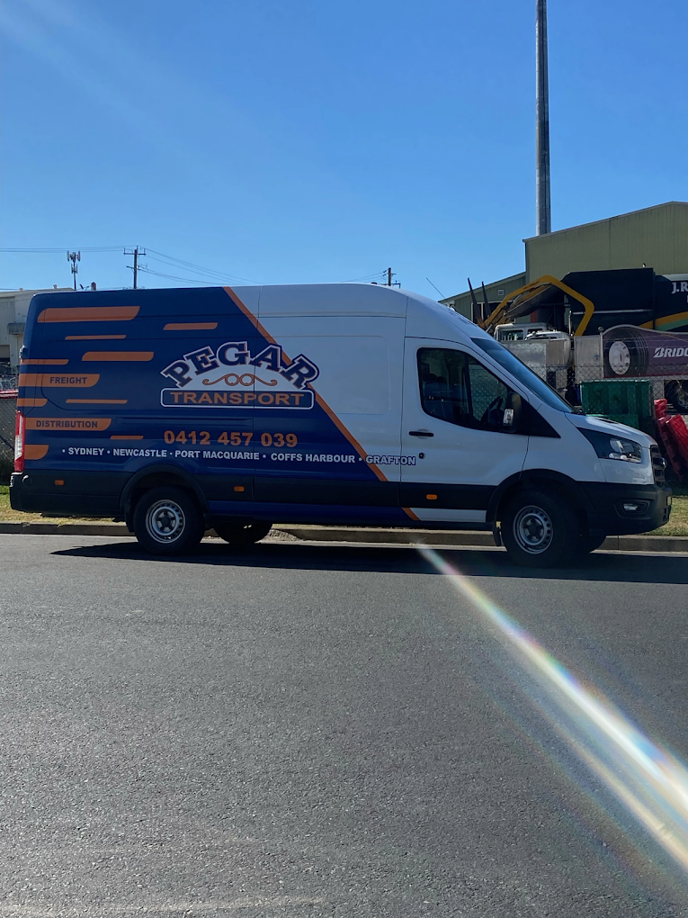 A Blue And White Van Is Parked On The Side Of The Road — Pegar Transport In Port Macquarie, NSW
