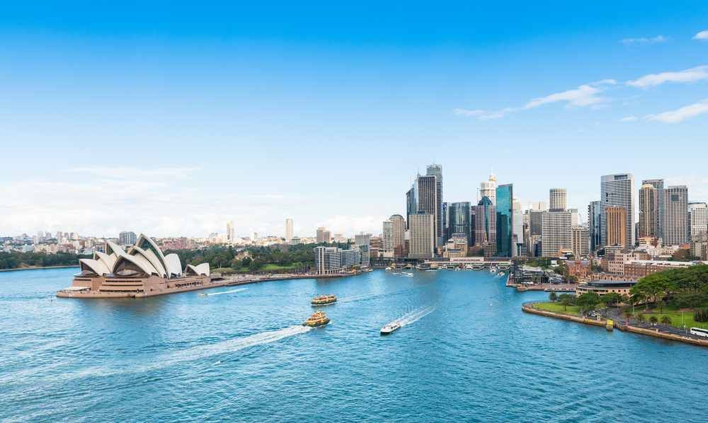 A Large Body Of Water With A City Skyline In The Background — Pegar Transport In Sydney, NSW