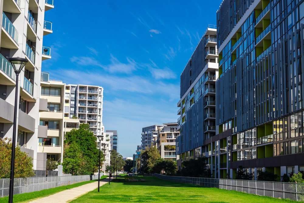 A Row Of Apartment Buildings With A Path Between Them — Pegar Transport In Sydney, NSW
