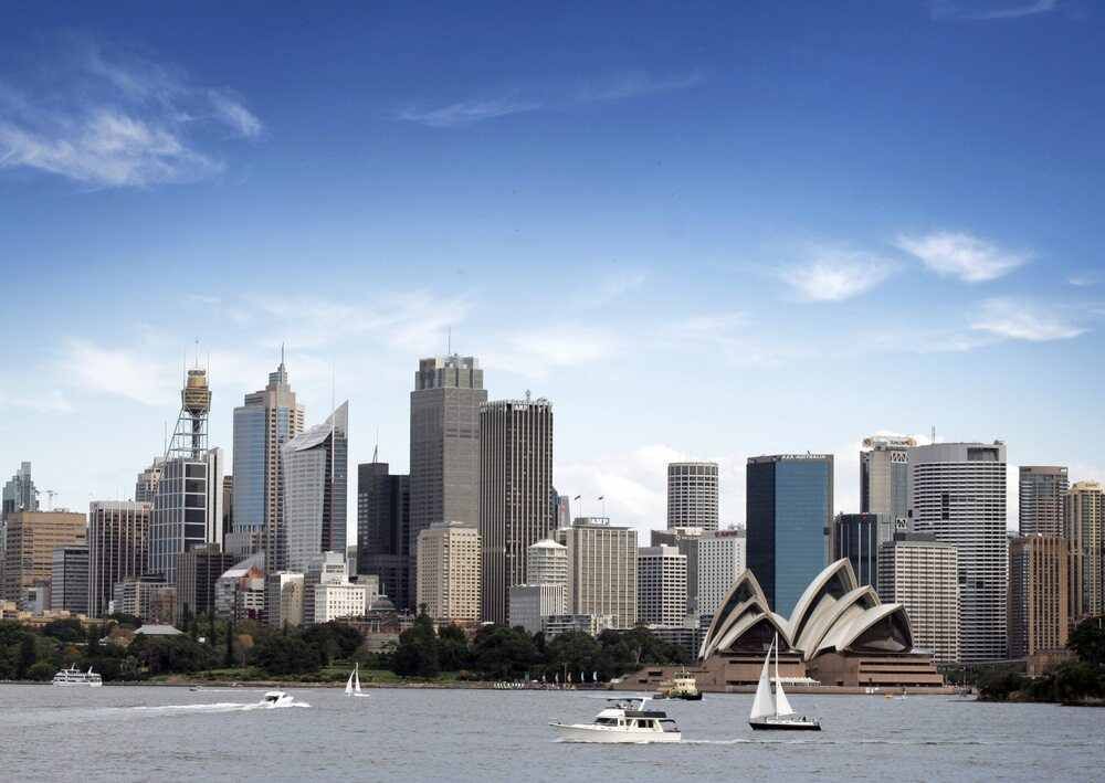 A City Skyline With The Opera House In The Foreground — Pegar Transport In Sydney, NSW
