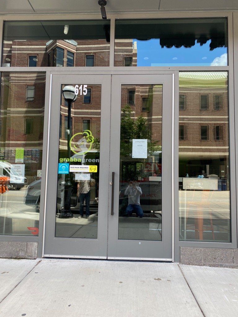 Gray double doors with glass panels; 