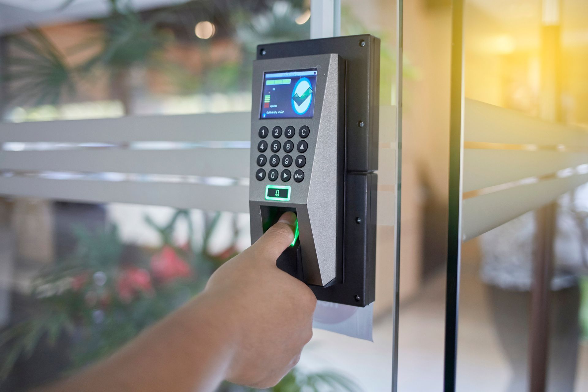 Access control system with keypad and fingerprint scanner from an institutional hardware supplier.