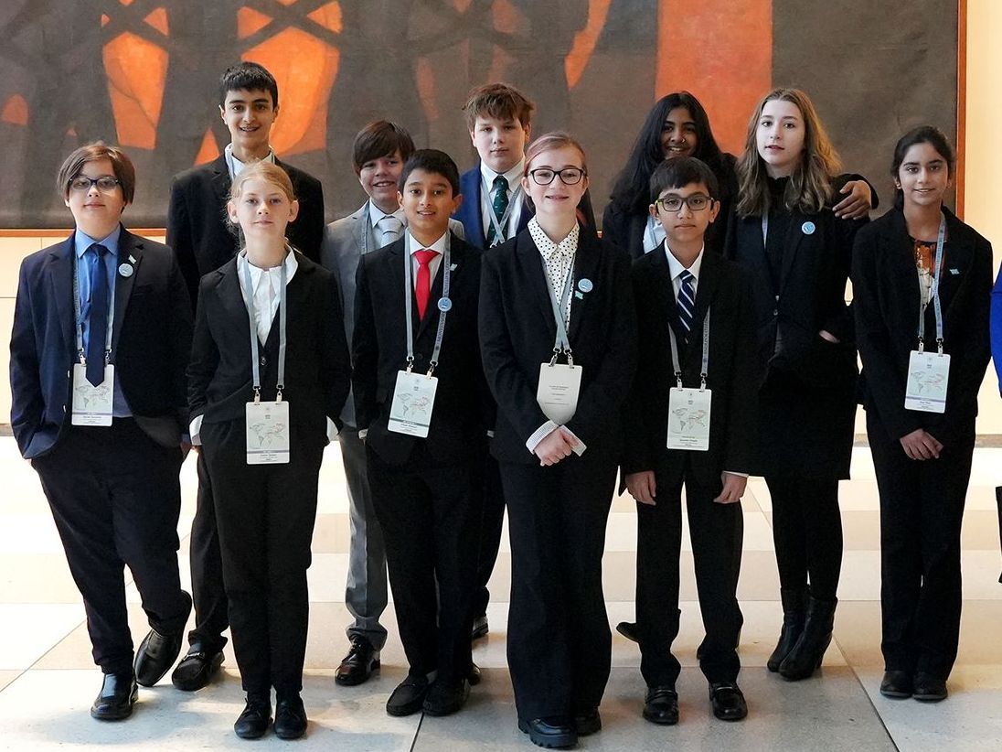 a group of Montessori young people are posing for a picture