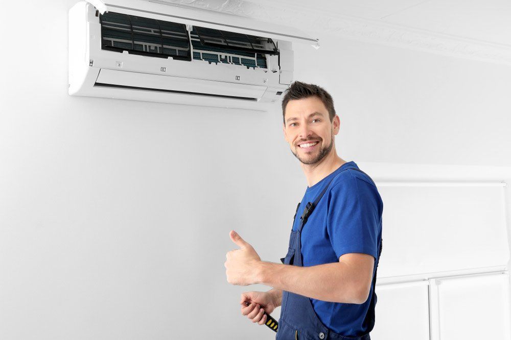 Man in Uniform Giving Thumbs Up — Big Electrics in Mareeba, QLD