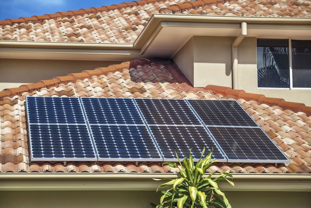 Solar Panels Installed on a Terracotta Tile Roof of a Home — Big Electrics in Redlynch, QLD