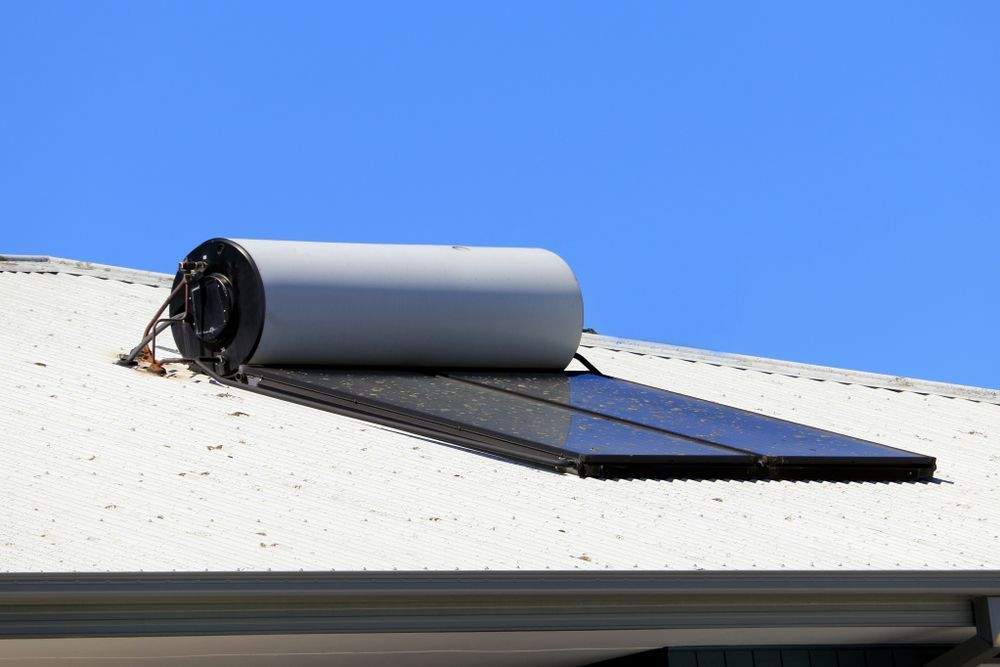 Solar Water Heater on a White Roof — Big Electrics in Redlynch, QLD