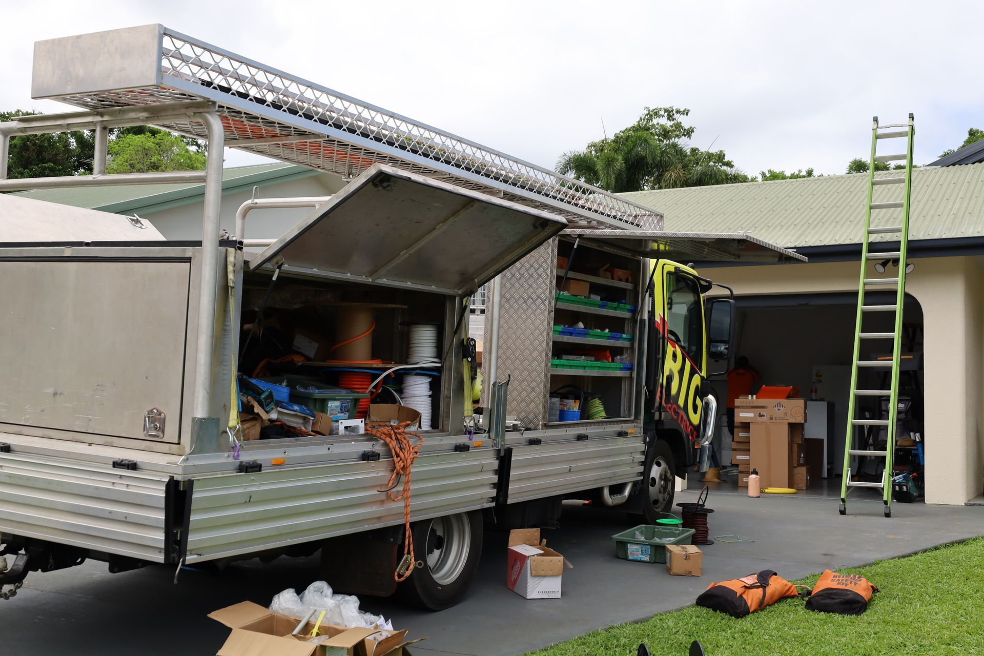 Technician Fixing Stage Lighting Equipment With a Screwdriver — Big Electrics in Redlynch, QLD