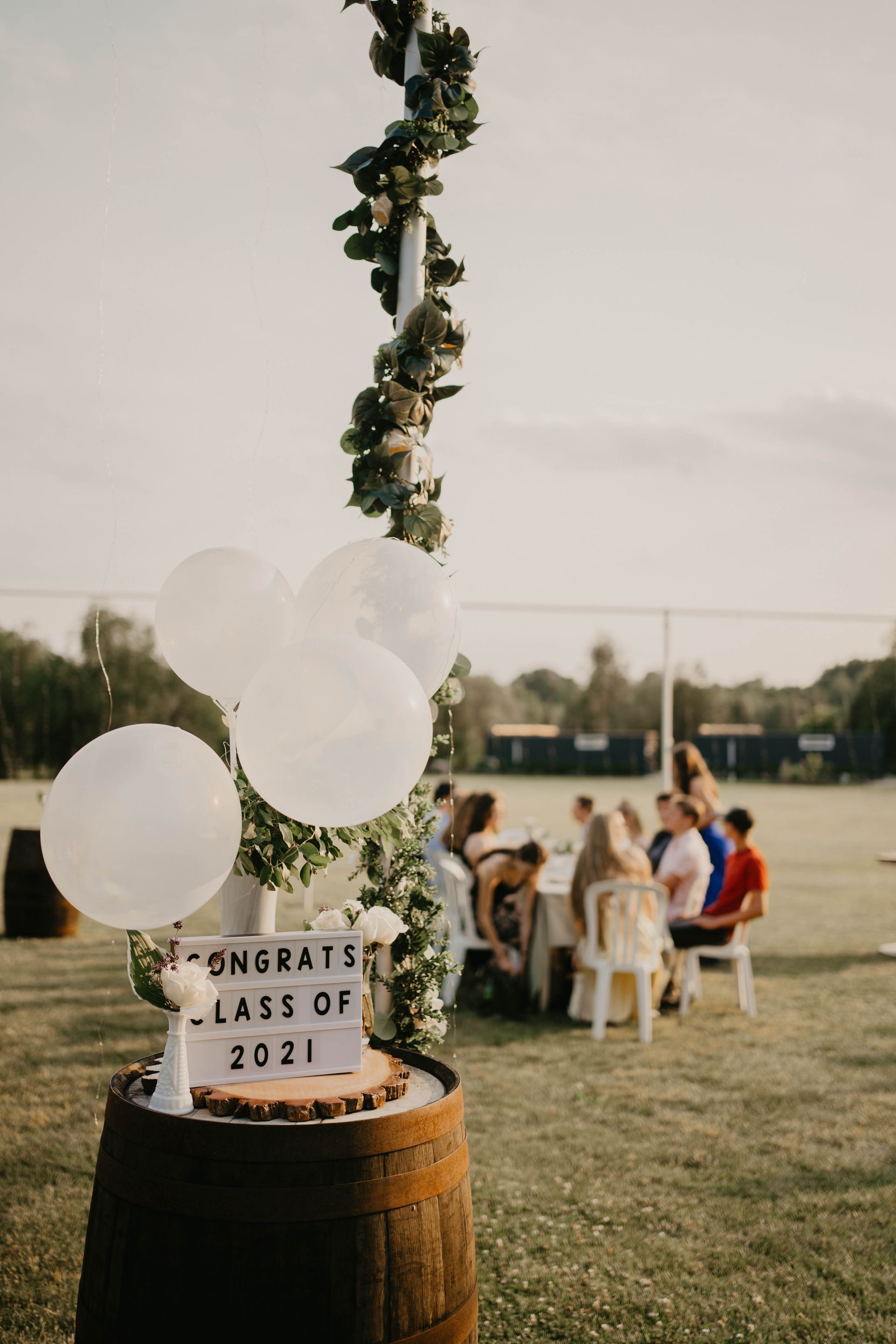 Graduation party with balloons, sign 